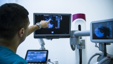 Healthcare provider reviewing a scanned image on a screen Healthcare provider reviewing a scanned image on a screen