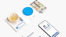 Healthy.io's Minuteful test kit, including a smartphone displaying the app