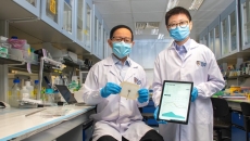 NUS team lead researchers pose with the VeCare platform for monitoring chronic wounds.