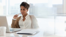 Person sitting at a desk Person sitting at a desk