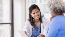 Healthcare professional consulting with a patient  Healthcare professional consulting with a patient