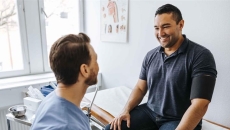 Patient sitting with a healthcare professional Patient sitting with a healthcare professional