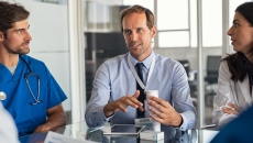 Healthcare professionals talking to pharmaceutical representative Healthcare professionals talking to pharmaceutical representative