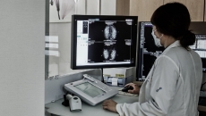 Doctor reviewing mammography findings from AI-powered software Doctor reviewing mammography findings from AI-powered software