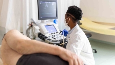 Imaging technician with patient Imaging technician with patient