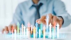 Businessperson and a digital interpretation of a financial graph Businessperson and a digital interpretation of a financial graph