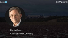 Martin Gaynor, Carnegie Mellon University Martin Gaynor, Carnegie Mellon University_Muddy field with hospital in background_Jason Jones Travel Photography/Moment/Getty Images