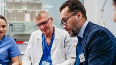 Advisor sitting with healthcare professionals Advisor sitting with healthcare professionals