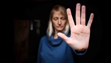 Person showing stop sign with hand Person showing stop sign with hand