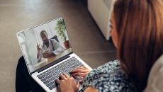 Patient interacting with healthcare professional via laptop Patient interacting with healthcare professional via laptop