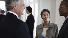 Executives conferring Executives conferring