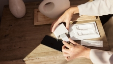 A person unboxing a Cue test. A person unboxing a Cue test.