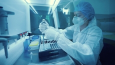 Technician working in a lab Technician working in a lab