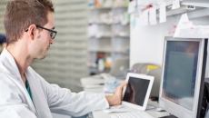 Healthcare professional looking at data on a screen Healthcare professional looking at data on a screen