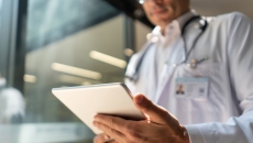 Clinician using a tablet PC Clinician using a tablet PC