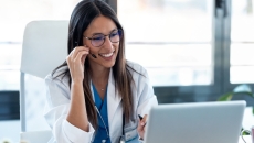 Healthcare professional interacting with a person via a PC Healthcare professional interacting with a person via a PC
