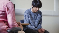 Two people sitting in a room Two people sitting in a room