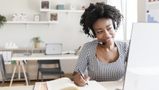 Healthcare worker engaging with someone via a PC Healthcare worker engaging with someone via a PC