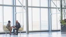 Executives conferring Executives conferring