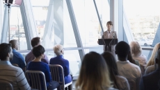 Person addressing business meeting Person addressing business meeting