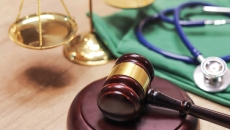 A gavel and a stethoscope. A gavel and a stethoscope.