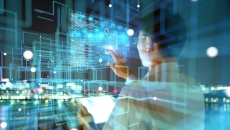 Person looking at digital images on a wall Person looking at digital images on a wall