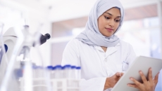 Person looking at the tablet Person looks at a tablet