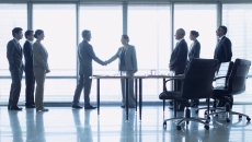 Business people closing a deal after a meeting Business people closing a deal after a meeting