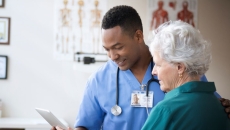 Two people looking at notes Two people looking at notes