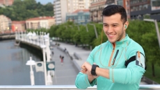 person using digital watch person using digital watch