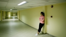 Person standing in the hall of a halfway house Person standing in the hall of a halfway house