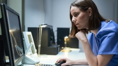 Technician reviewing MRI data Technician reviewing MRI data