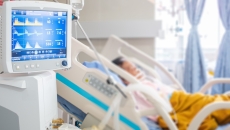 Image of patient in hospital with vital-sign-monitoring device Image of patient in hospital with vital-sign-monitoring device