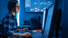 Technician looking at PC screen Technician looking at PC screen