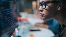 Person reviewing data on a PC Person reviewing data on a PC