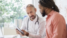 Health care professional consulting with patient Health care professional consulting with patient