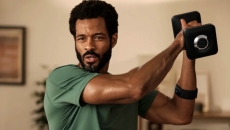 A man lifting a weight wearing the heart rate monitor A man lifting a weight wearing the heart rate monitor