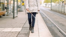Person walking with a cane Person walking with a cane