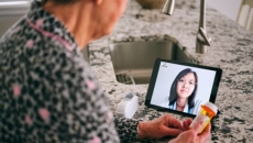 person looking at tablet screen person looking at tablet screen