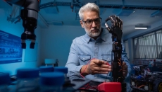 Robotics engineer working on a prosthetic Robotics engineer working on a prosthetic