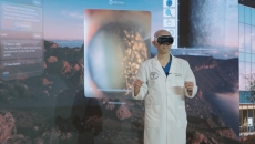 Healthcare provider wearing an augmented reality headset and surrounded by a virtual environment Healthcare provider wearing an augmented reality headset and surrounded by a virtual environment