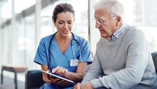 Heathcare professional consulting with patient. Heathcare professional consulting with patient.