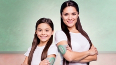 An adult and child wearing the Nerivio device. An adult and child wearing the Nerivio device.