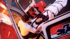 Paramedics loading a patient onto an ambulance Paramedics loading a patient onto an ambulance
