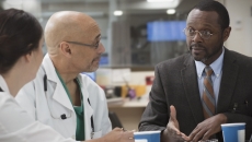 Clinicians in discussion with administrator Clinicians in discussion with administrator