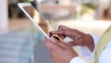 A close up shot of a woman using a tablet A close up shot of a woman using a tablet