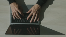 Person typing on a laptop