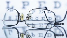 Glasses lying in front of an eye chart Glasses lying in front of an eye chart