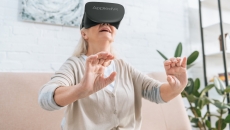A woman using an AppliedVR headset at home A woman using an AppliedVR headset at home