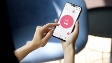 A woman using the Flo period tracker A woman using the Flo period tracker